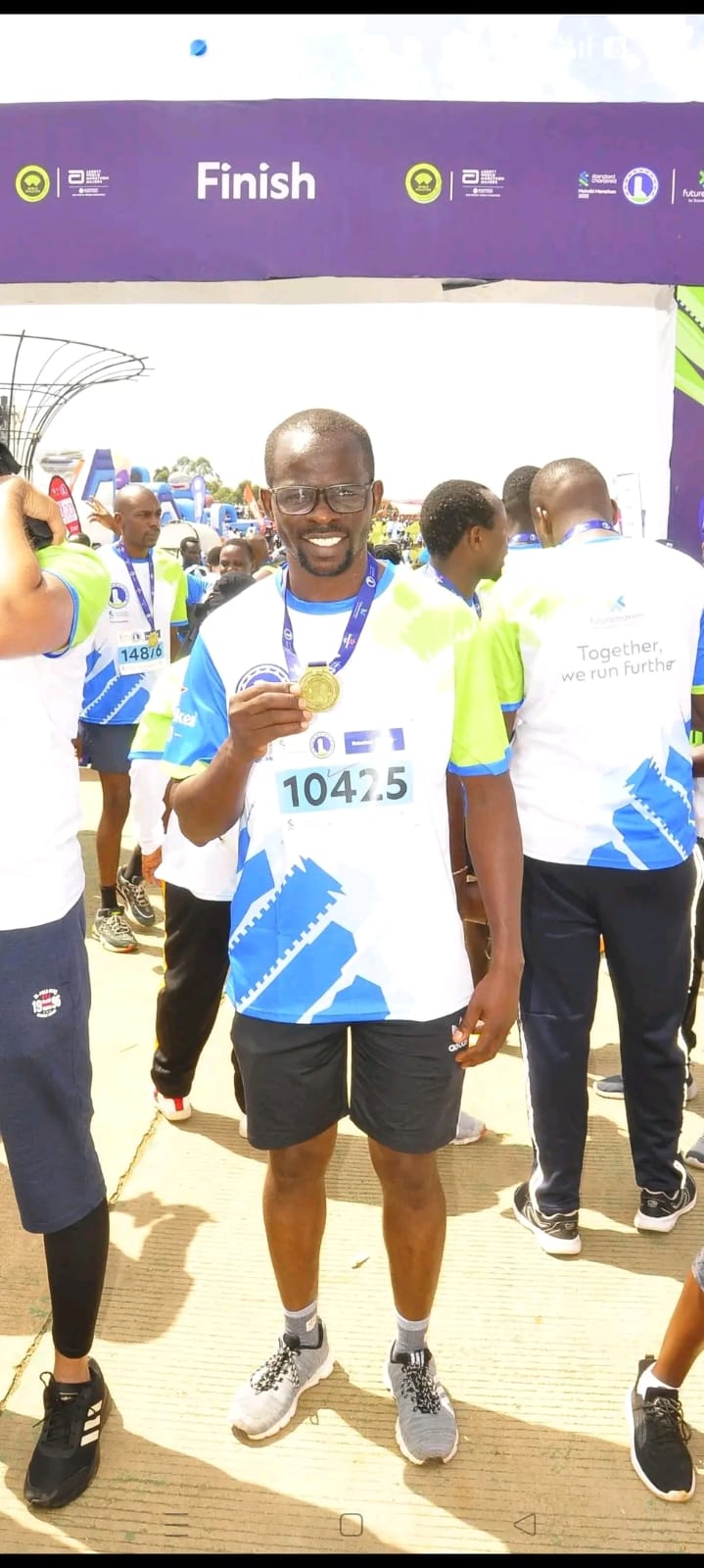 Afyafit runner with a finisher medal